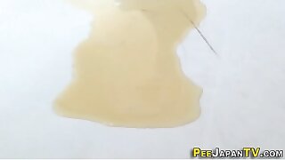 Japanese babe pees puddle